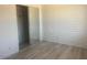Bedroom has a closet and wood-look flooring at 5518 E Lindstrom Ln # B3, Mesa, AZ 85215