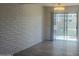 Living room with sliding glass door to outdoor patio and view at 5518 E Lindstrom Ln # B3, Mesa, AZ 85215