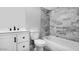 Elegant bathroom showcasing tiled walls, modern vanity, and well-maintained fixtures at 600 S Dobson Rd # 175, Mesa, AZ 85202