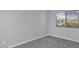 Cozy bedroom with plush carpeting, neutral walls, and a bright window at 600 S Dobson Rd # 175, Mesa, AZ 85202