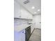 Updated kitchen featuring stainless steel appliances, white cabinets, and ample counter space at 600 S Dobson Rd # 175, Mesa, AZ 85202