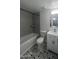 Updated bathroom featuring a shower and tub combo with stylish tile and vanity with storage at 623 W Guadalupe Rd # 131, Mesa, AZ 85210