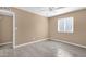 Bedroom with tile floors, a window, and doors leading to the bathroom and closet at 623 W Guadalupe Rd # 131, Mesa, AZ 85210