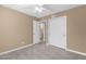 Bedroom with tile floors, a window, and doors leading to the bathroom and closet at 623 W Guadalupe Rd # 131, Mesa, AZ 85210