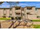 An exterior view of a condo featuring two floors, and stairs at 623 W Guadalupe Rd # 131, Mesa, AZ 85210