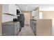 Open kitchen featuring stainless steel appliances, light countertops, and sleek cabinetry at 623 W Guadalupe Rd # 131, Mesa, AZ 85210