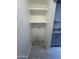 Handy laundry room area with shelving and modern tile floors at 623 W Guadalupe Rd # 131, Mesa, AZ 85210