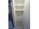 Convenient laundry room area featuring shelving and appliance hookups at 623 W Guadalupe Rd # 131, Mesa, AZ 85210
