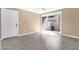 Inviting living room with access to a private outdoor patio, enhanced by neutral tones and tile flooring at 623 W Guadalupe Rd # 131, Mesa, AZ 85210