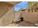Private patio with exterior stone wall, and gravel floor at 623 W Guadalupe Rd # 131, Mesa, AZ 85210