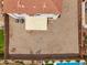 The home features a backyard with a built-in fire pit, an expansive patio, and an in-ground pool at 647 E Palomino Way, San Tan Valley, AZ 85143