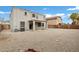 Backyard with a stucco exterior, covered patio, and low-maintenance landscape at 647 E Palomino Way, San Tan Valley, AZ 85143