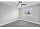 Neutral bedroom with ceiling fan, light gray carpet, and one window at 647 E Palomino Way, San Tan Valley, AZ 85143