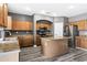 Modern kitchen with stainless steel appliances and a functional center island at 647 E Palomino Way, San Tan Valley, AZ 85143