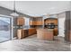 Modern kitchen with stainless steel appliances, a central island, and ample cabinets at 647 E Palomino Way, San Tan Valley, AZ 85143