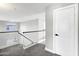 Spacious upstairs hallway with black and white railing, and several rooms at 647 E Palomino Way, San Tan Valley, AZ 85143