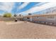 Spacious backyard featuring gravel landscaping, a built-in grill area, and block wall fencing for privacy at 7546 E Clovis Cir, Mesa, AZ 85208
