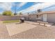 Spacious backyard featuring gravel landscaping, a built-in grill area, and block wall fencing for privacy at 7546 E Clovis Cir, Mesa, AZ 85208