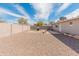 Spacious backyard featuring gravel landscaping, a built-in grill area, and block wall fencing for privacy at 7546 E Clovis Cir, Mesa, AZ 85208