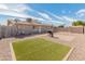 Spacious backyard featuring gravel landscaping, a built-in grill area, and block wall fencing for privacy at 7546 E Clovis Cir, Mesa, AZ 85208