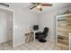 Bedroom featuring neutral paint, a ceiling fan, and tile floors, perfect for an office at 7546 E Clovis Cir, Mesa, AZ 85208