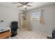 Bright bedroom featuring neutral paint, a ceiling fan, and tile floors throughout at 7546 E Clovis Cir, Mesa, AZ 85208