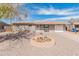 Charming single-story home featuring a low-maintenance front yard and attached one car garage at 7546 E Clovis Cir, Mesa, AZ 85208