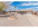 Charming single-story home featuring a low-maintenance front yard and attached one car garage at 7546 E Clovis Cir, Mesa, AZ 85208