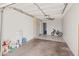 Spacious two car garage with tile floors and a ceiling fan for comfort at 7546 E Clovis Cir, Mesa, AZ 85208
