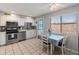 Modern kitchen features stainless steel appliances and a view into the dining area at 7546 E Clovis Cir, Mesa, AZ 85208