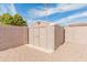 Neutral-colored backyard storage shed with double doors for easy access to all your outdoor storage needs at 7546 E Clovis Cir, Mesa, AZ 85208