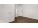 A view of a carpeted bedroom and white walls with the entry way visible at 806 W Summerside Rd, Phoenix, AZ 85041