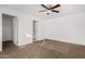 Cozy bedroom with carpet flooring, neutral paint, ceiling fan, and ample natural light at 806 W Summerside Rd, Phoenix, AZ 85041