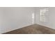 This bedroom features neutral carpet, a window, and white walls at 806 W Summerside Rd, Phoenix, AZ 85041
