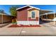 Charming home showcasing unique color combination, landscaping, covered parking, and accessibility ramp at 806 W Summerside Rd, Phoenix, AZ 85041