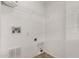 This laundry room features tile flooring, shelving, and utility hookups at 806 W Summerside Rd, Phoenix, AZ 85041