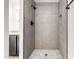 Modern bathroom with an updated shower featuring a gray tiled wall and mosaic tile floor at 806 W Summerside Rd, Phoenix, AZ 85041