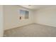 Neutral bedroom offering ample space and natural light from a window showcasing the exterior block fence at 12738 N 172Nd Dr, Surprise, AZ 85388
