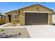 Charming single-story home featuring a two-car garage, desert landscaping, and a covered front entry at 12738 N 172Nd Dr, Surprise, AZ 85388