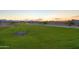 Expansive community green space with walking path and a view of the mountains at 12738 N 172Nd Dr, Surprise, AZ 85388