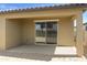 This covered patio includes a concrete floor and sliding glass doors to the interior at 12738 N 172Nd Dr, Surprise, AZ 85388