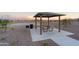 Community pavilion with picnic tables and a BBQ grill at 12738 N 172Nd Dr, Surprise, AZ 85388