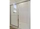Modern shower enclosure with clear glass doors and chrome hardware, showcasing a clean, minimalist design at 12738 N 172Nd Dr, Surprise, AZ 85388