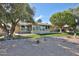 Charming backyard featuring a bright sunroom and desert landscaping for easy maintenance at 12834 W Ashwood Dr, Sun City West, AZ 85375