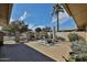 Secluded backyard showcasing a patio area with comfortable seating, lush desert landscaping, and a serene outdoor ambiance at 12834 W Ashwood Dr, Sun City West, AZ 85375