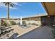 Private backyard featuring a cozy seating area, desert landscaping, and ample space for outdoor relaxation and entertainment at 12834 W Ashwood Dr, Sun City West, AZ 85375