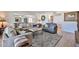 Inviting living room with stylish sofas, decorative rug, and an open layout, creating a comfortable and welcoming space at 12834 W Ashwood Dr, Sun City West, AZ 85375