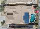 Aerial view of the property with a pool, outdoor kitchen, and solar panels on the roof at 12873 N 175Th Dr, Surprise, AZ 85388