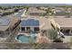 Aerial view of the property featuring the pool, outdoor kitchen, and solar panels at 12873 N 175Th Dr, Surprise, AZ 85388