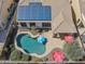 Aerial view shows solar panels, roof, backyard pool, patio, and desert landscaping at 12873 N 175Th Dr, Surprise, AZ 85388